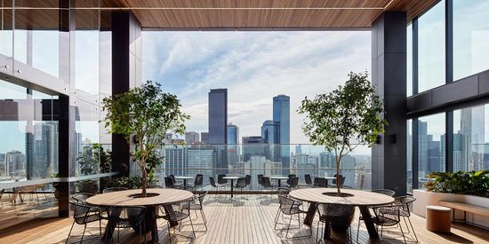 An elevated outdoor patio at Collins Square looking out towards the Melbourne CBD