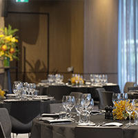 Cabaret style seating at one of the Conference and Events rooms at Collins Square