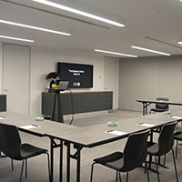 U-shaped table set up within the multi-purpose meeting room at Collins Square