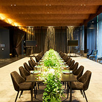 Long table with greenery set up for a function at Collins Square