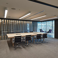 Large desk at at the set boardroom at Collins Square