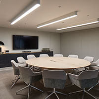 Round table set up at the set boardroom at Collins Square