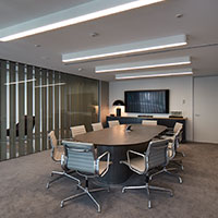 Oval table set up for a meeting at the set boardroom at Collins Square