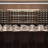 View of the wine racks within the wine room at Collins Square