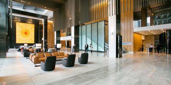 The lobby of a tower at Collins Square with the artwork King Sun prominently visible