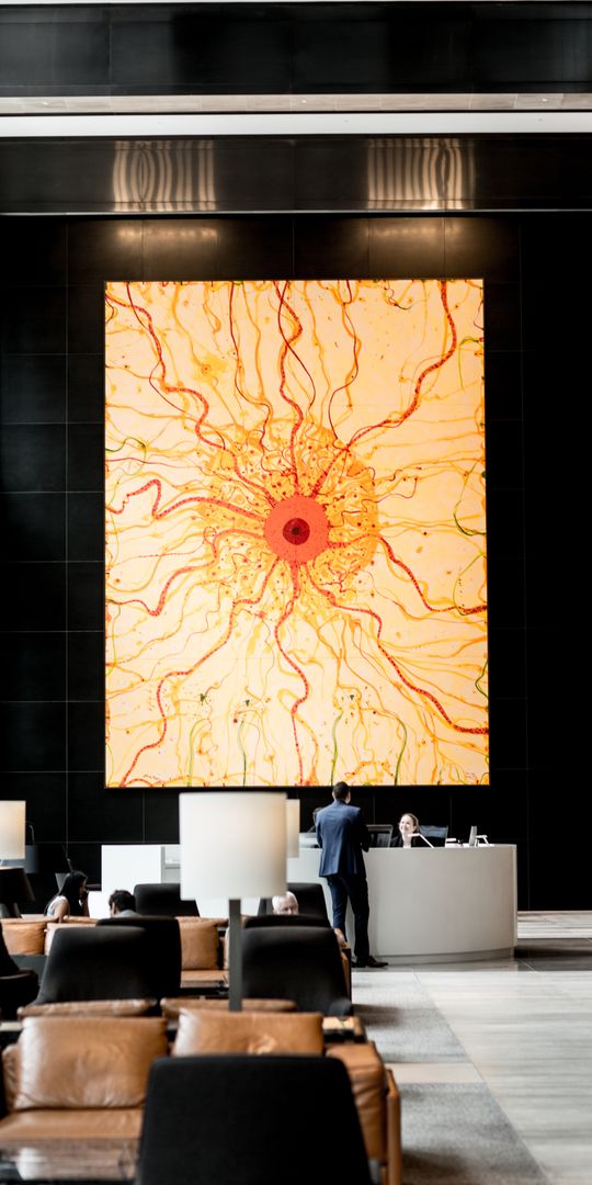 The artwork King Sun overlooking the lobby of Tower 1 at Collins Square