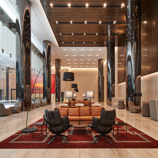 Lounges and seating areas within the lobby of Tower 4 at Collins Square